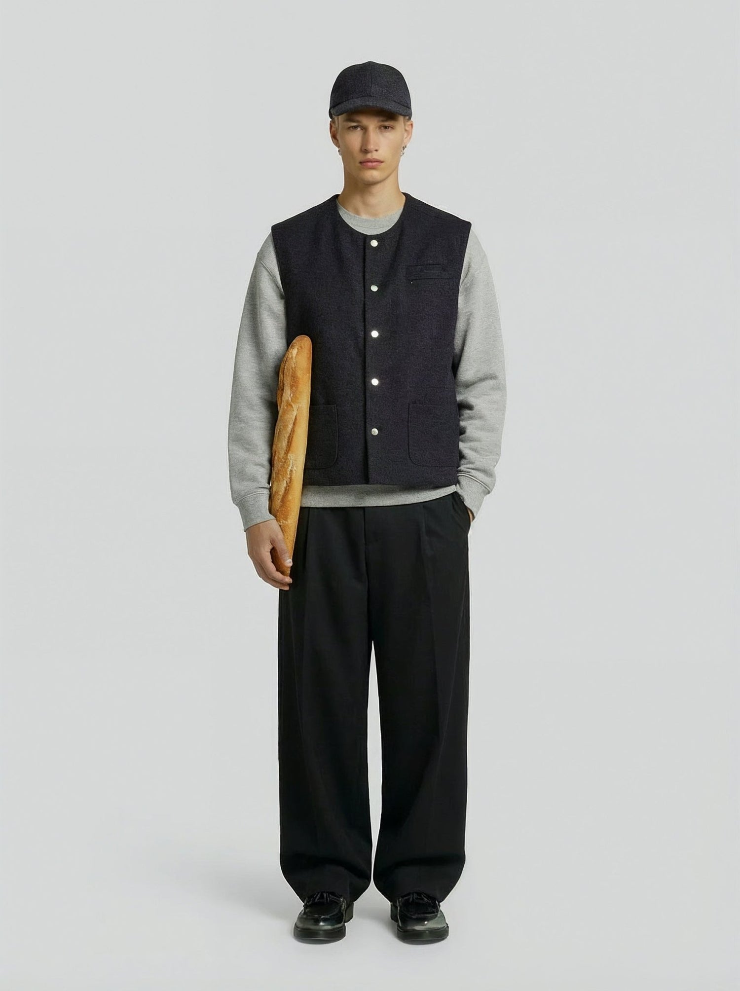 LA VESTE SANS MANCHES GRISE EN LAINE