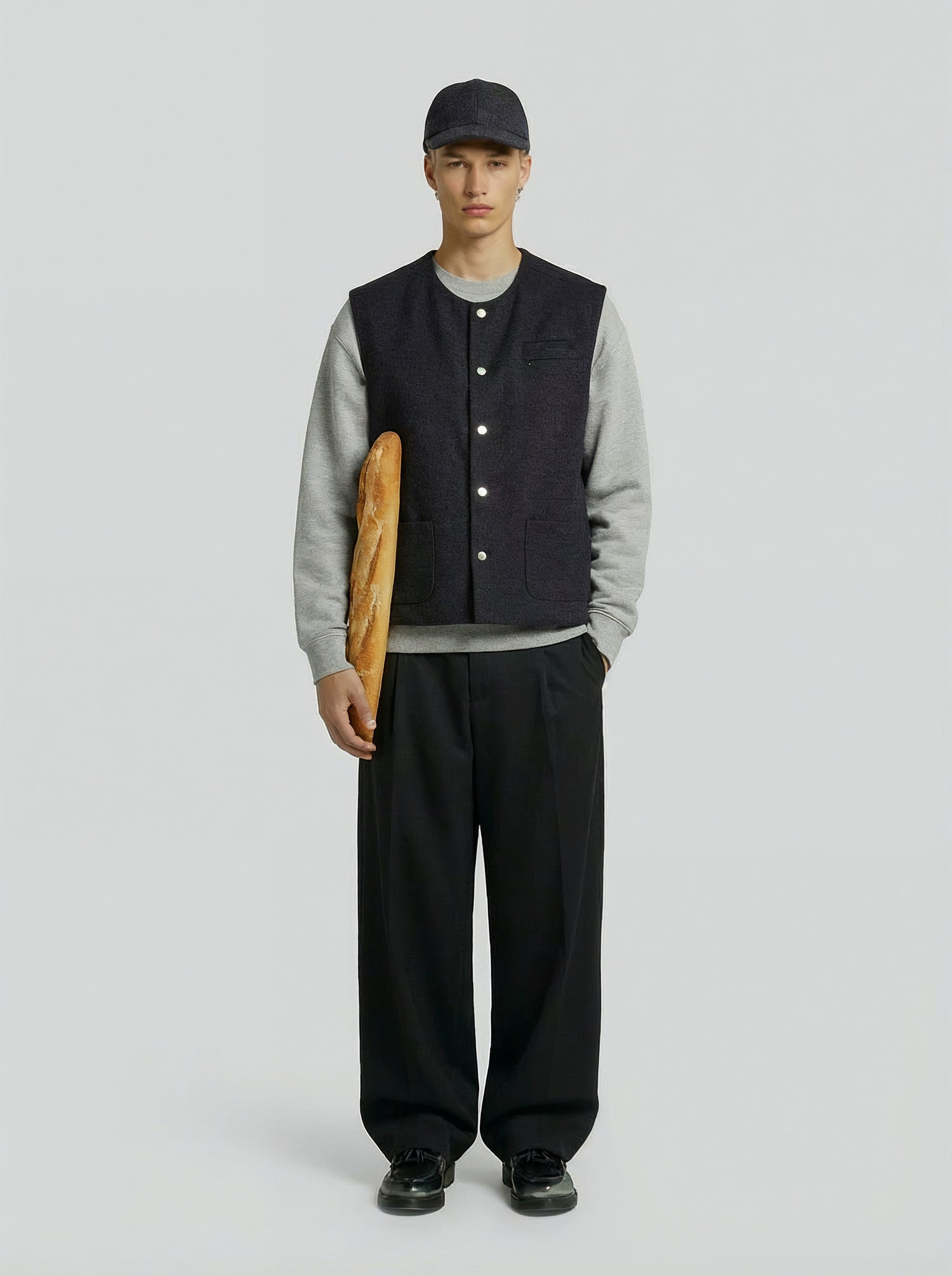 LA VESTE SANS MANCHES GRISE EN LAINE